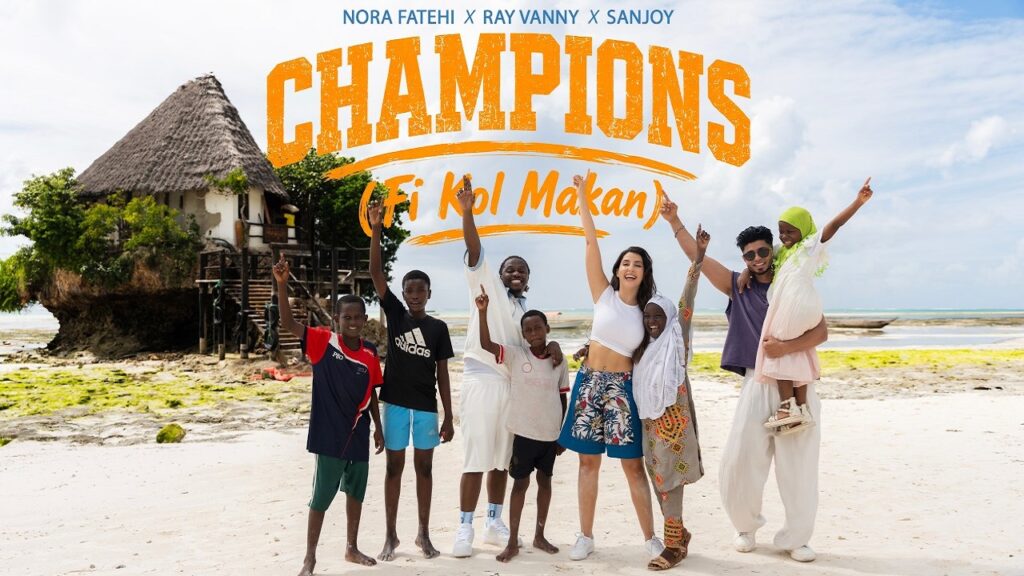 CHAMPIONS – Fi Kol Makan Lyrics – Nora Fatehi, Rayvanny